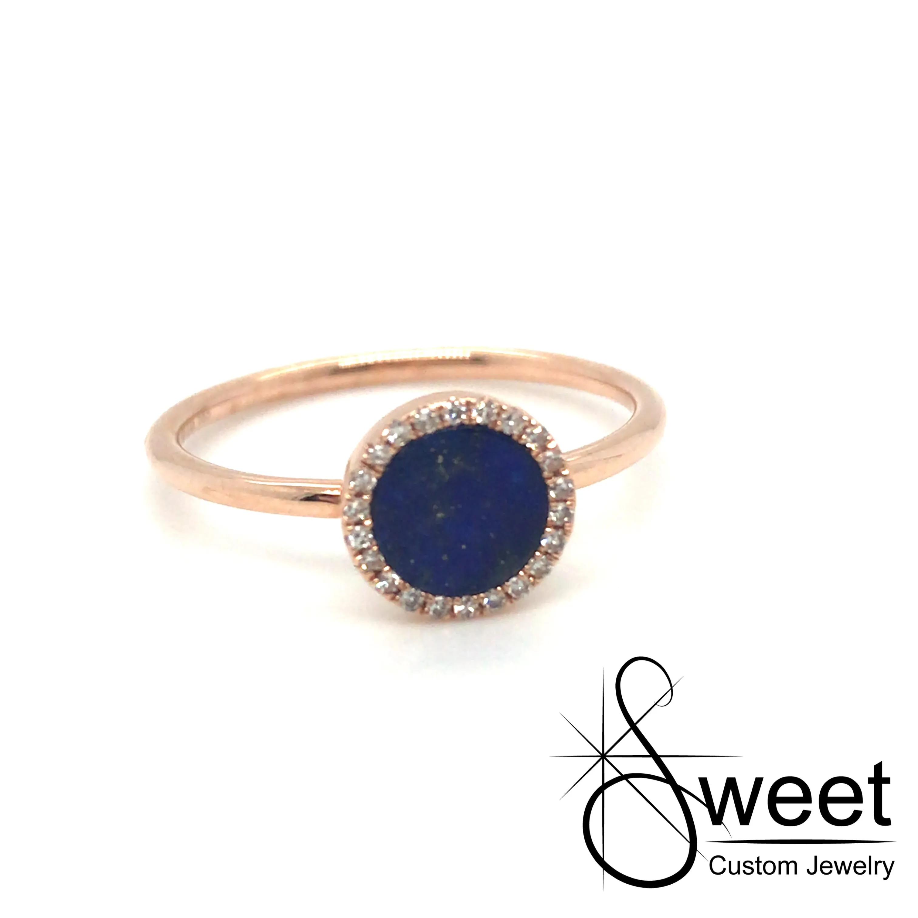 14kt ROSE GOLD RING FEATURING ONE ROUND LAPIS WITH A HALO OF ROUND DIAMONDS .06CTTW