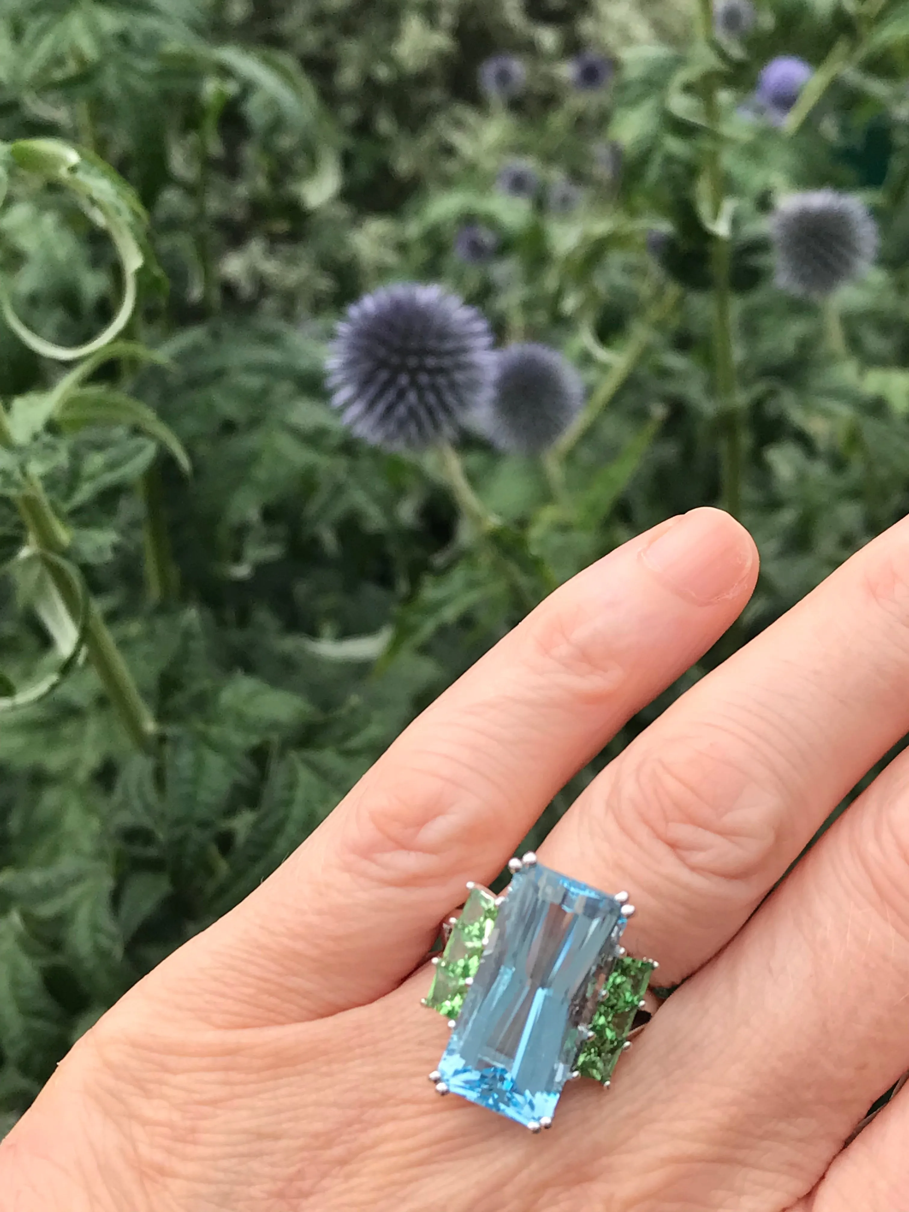 18ct White gold blue topaz ring with tzavorite side stones