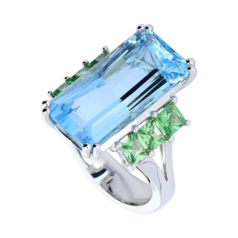 18ct White gold blue topaz ring with tzavorite side stones