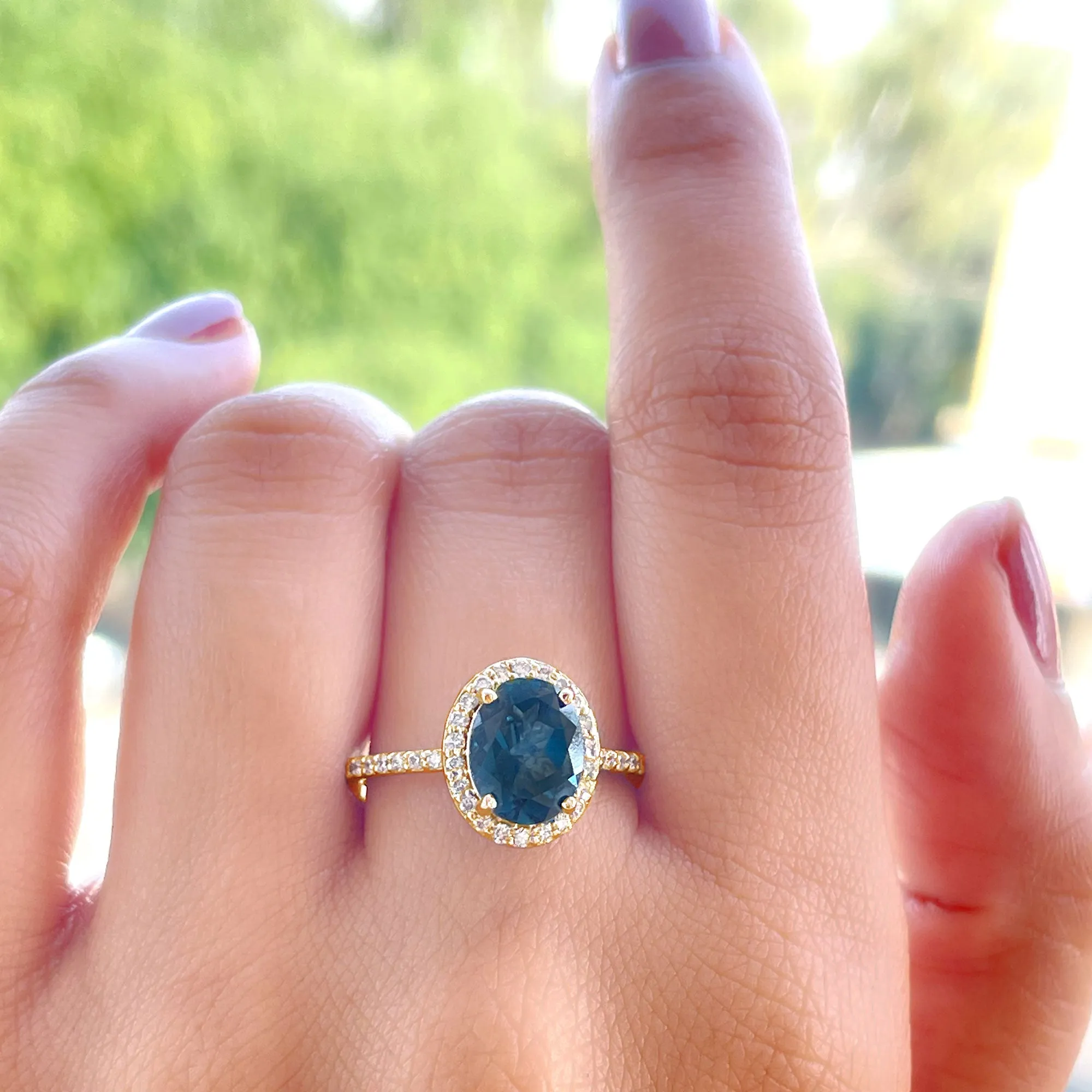 3 CT Classic Oval Cut London Blue Topaz and Diamond Halo Ring