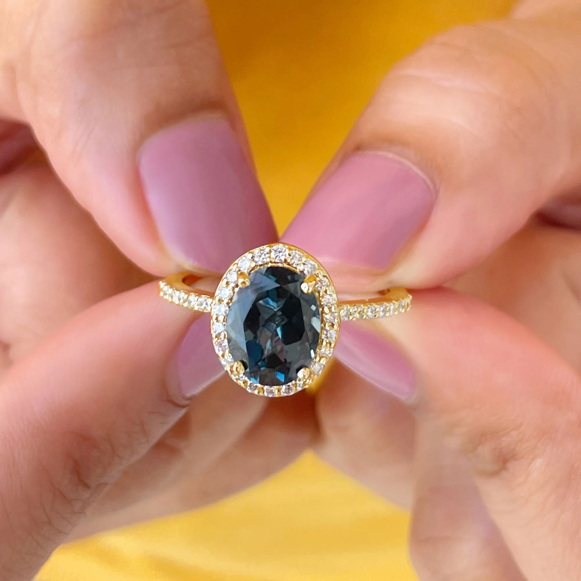 3 CT Classic Oval Cut London Blue Topaz and Diamond Halo Ring