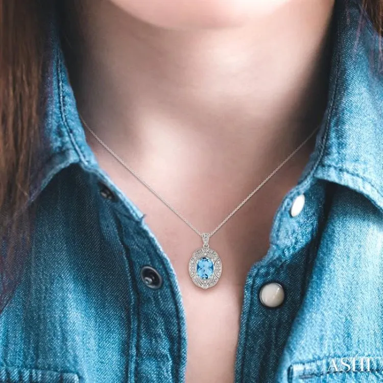 9x7  MM Oval Cut Blue Topaz and 1/50 ctw Single Cut Diamond Pendant in Sterling Silver with Chain