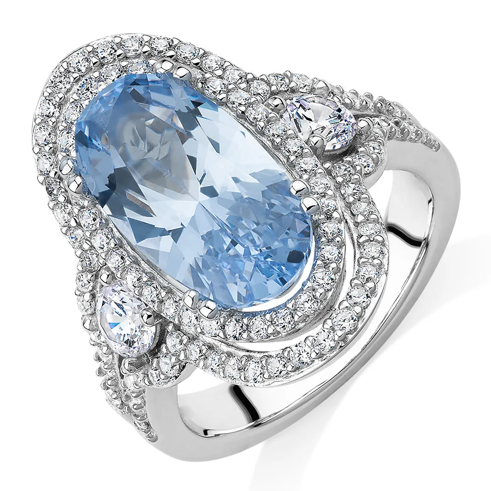 Dress ring with blue topaz simulant and 1.42 carats* of diamond simulants in sterling silver